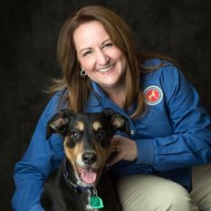 A woman With a Black Dog